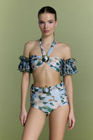 Nur Karaata Coconut Coastline Bikini featuring a vibrant tropical print and adjustable straps on a model.