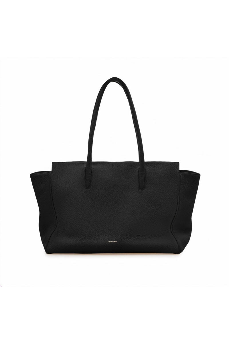 Black Vikele Studio tote bag with shoulder straps, made of durable material, shown hanging with open top and spacious interior.