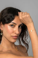 Adjustable gold moon bracelet by Freya Rose featuring a delicate crescent moon charm on a sleek gold band.
