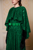 Elegant green A-line gown with a mullet cape from I.H.F, featuring flowing fabric and stylish design for formal occasions.