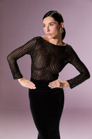 Elegant AURELINE gown by Nur Karaata, featuring flowing fabric and sophisticated design, perfect for formal occasions.