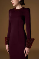 Red AURORA crepe silk lined gown by I.H.F, featuring elegant draping and luxurious fabric, displayed on a mannequin.