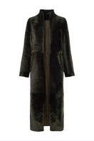 Verheyen Bella reversible shearling coat featuring plush shearling on both sides, stylishly displayed on a hanger.