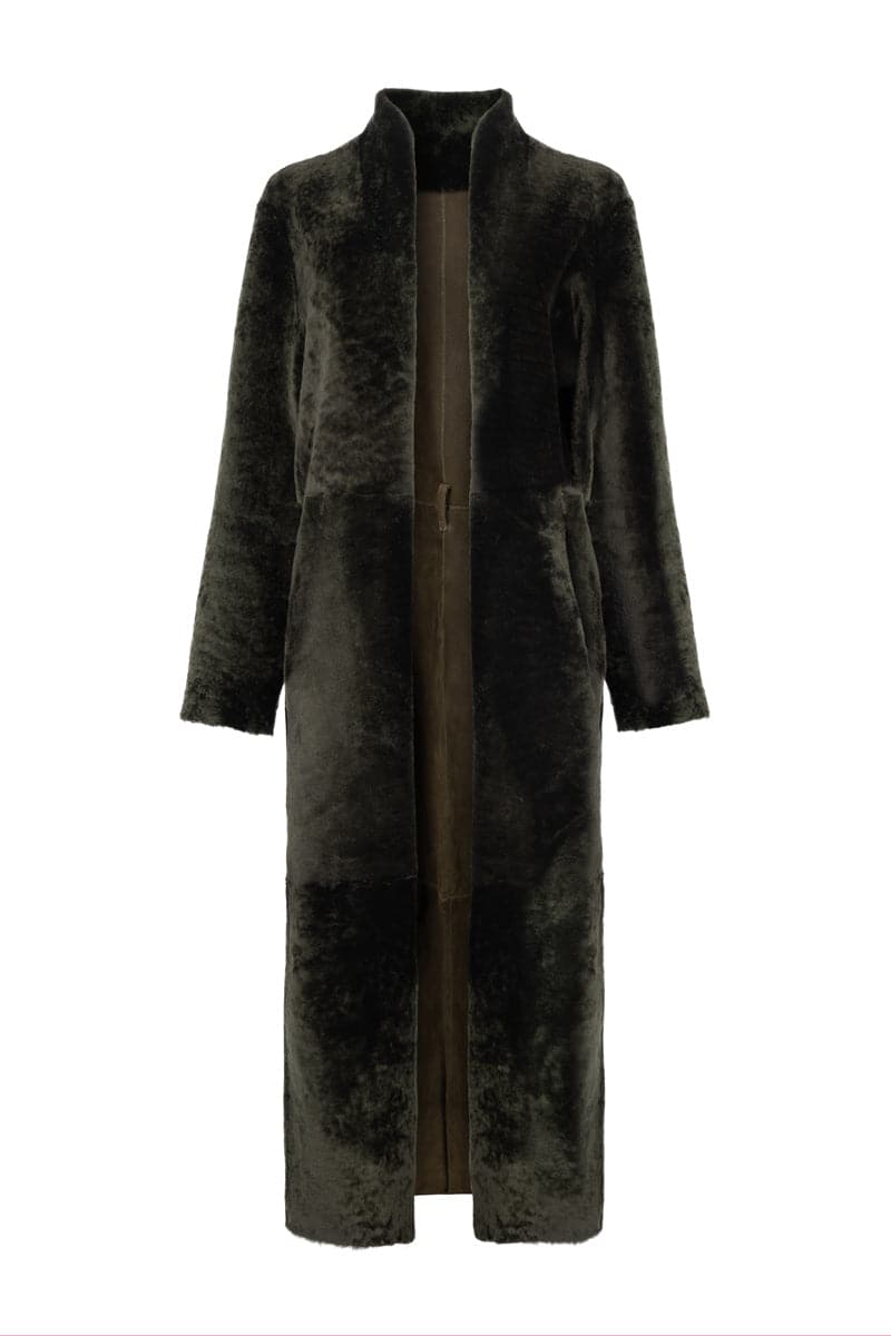 Verheyen Bella reversible shearling coat featuring plush shearling on both sides, stylishly displayed on a hanger.