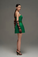 Dark green I.H.F Studio bustier mini dress displayed on a hanger, showcasing the fitted bodice and stylish design.