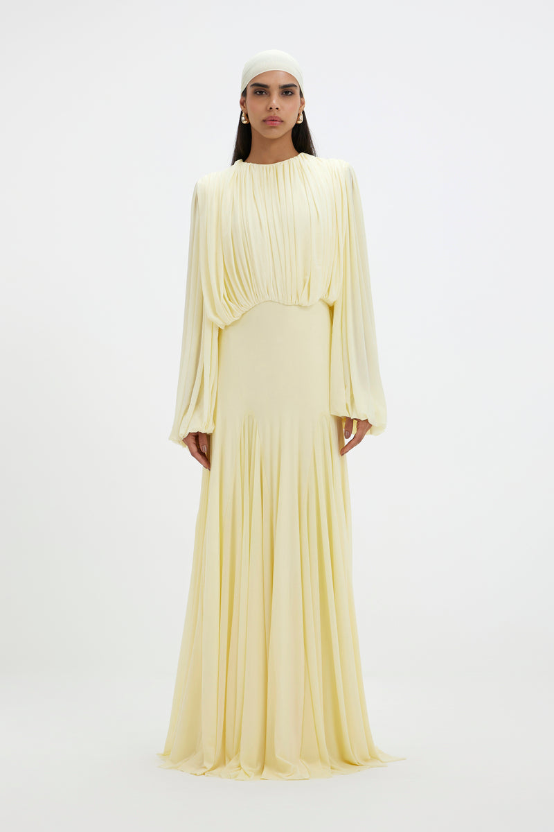 Deme By Gabriella Jeanie Maxi Dress featuring a flowy silhouette, floral print, and adjustable straps on a model.