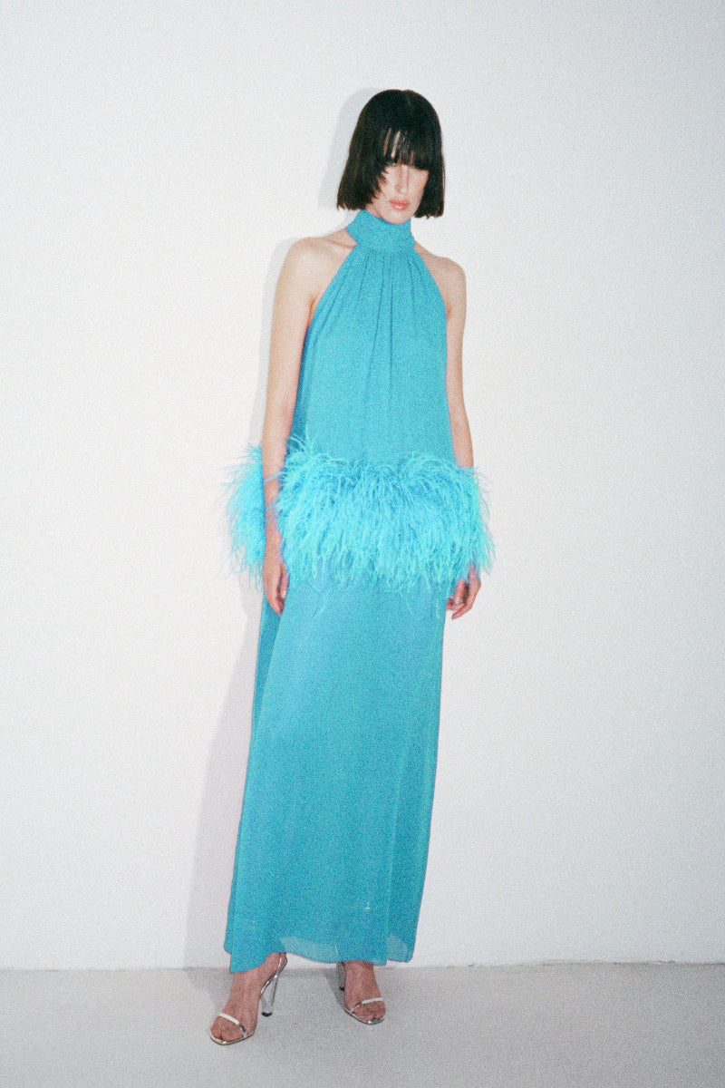 Nué Anaïs blue gown, elegant dress with flowing fabric and detailed design, perfect for formal occasions.