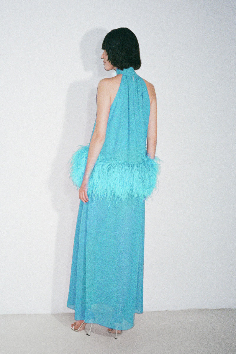 Nué Anaïs blue gown showcasing elegant fabric and flowing design, perfect for formal occasions.