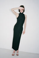 Black ROMY maxi dress by Nué, featuring a flowing silhouette and elegant design, shown on a model.
