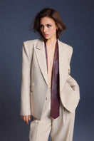 Keira Tong lined pants in neutral fabric with a tailored fit and straight-leg design, shown on a model.