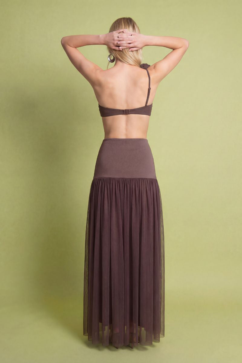 Brown Delfina maxi skirt by Laura Escobar, flowing fabric with a high waist and elegant design, shown in the product image.