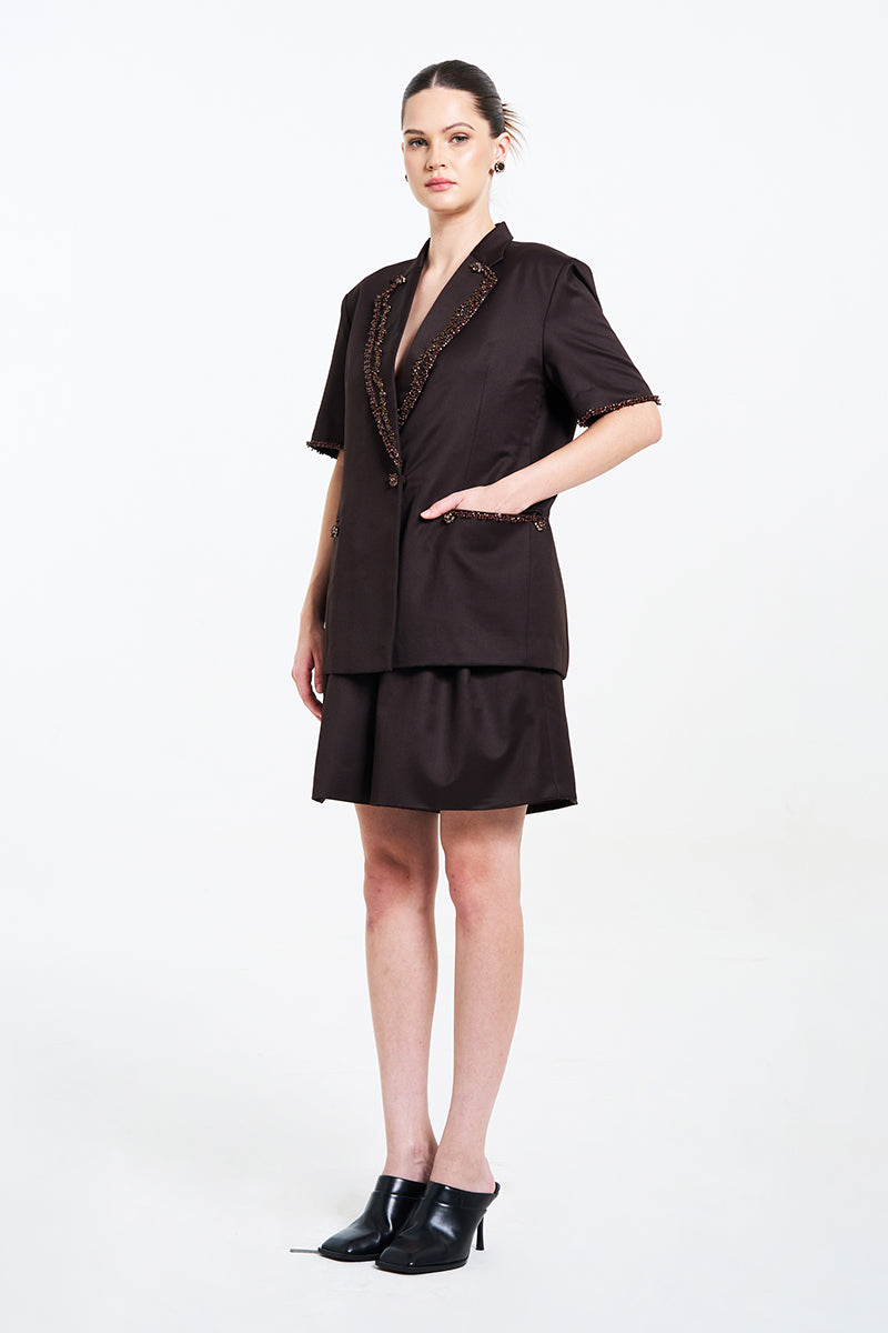 Aidan & Ice NARA brown blazer for women, tailored blazer with a classic fit and stylish design, shown on a hanger.