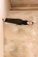 Arti Apparel Laurent Maxi Skirt in flowy fabric with a high waist and elegant length, styled with a subtle pattern.