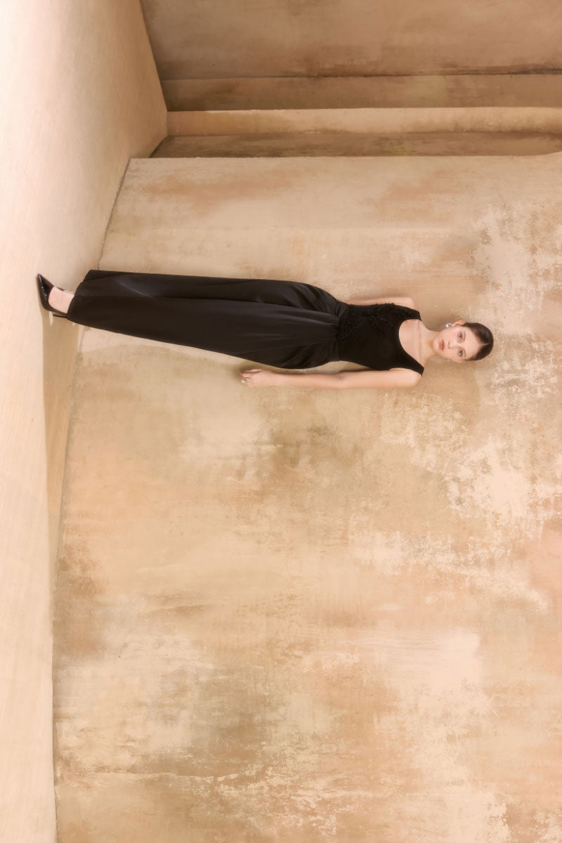 Arti Apparel Laurent Maxi Skirt in flowy fabric with a high waist and elegant length, styled with a subtle pattern.