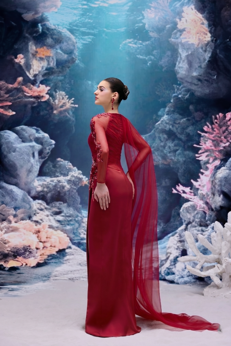 Red IRENA tulle and silk taffeta gown by 21Six, featuring a flowing silhouette and elegant design in the image.