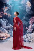 Red IRENA tulle and silk taffeta gown by 21Six featuring flowing fabric, elegant design, and a sophisticated silhouette.