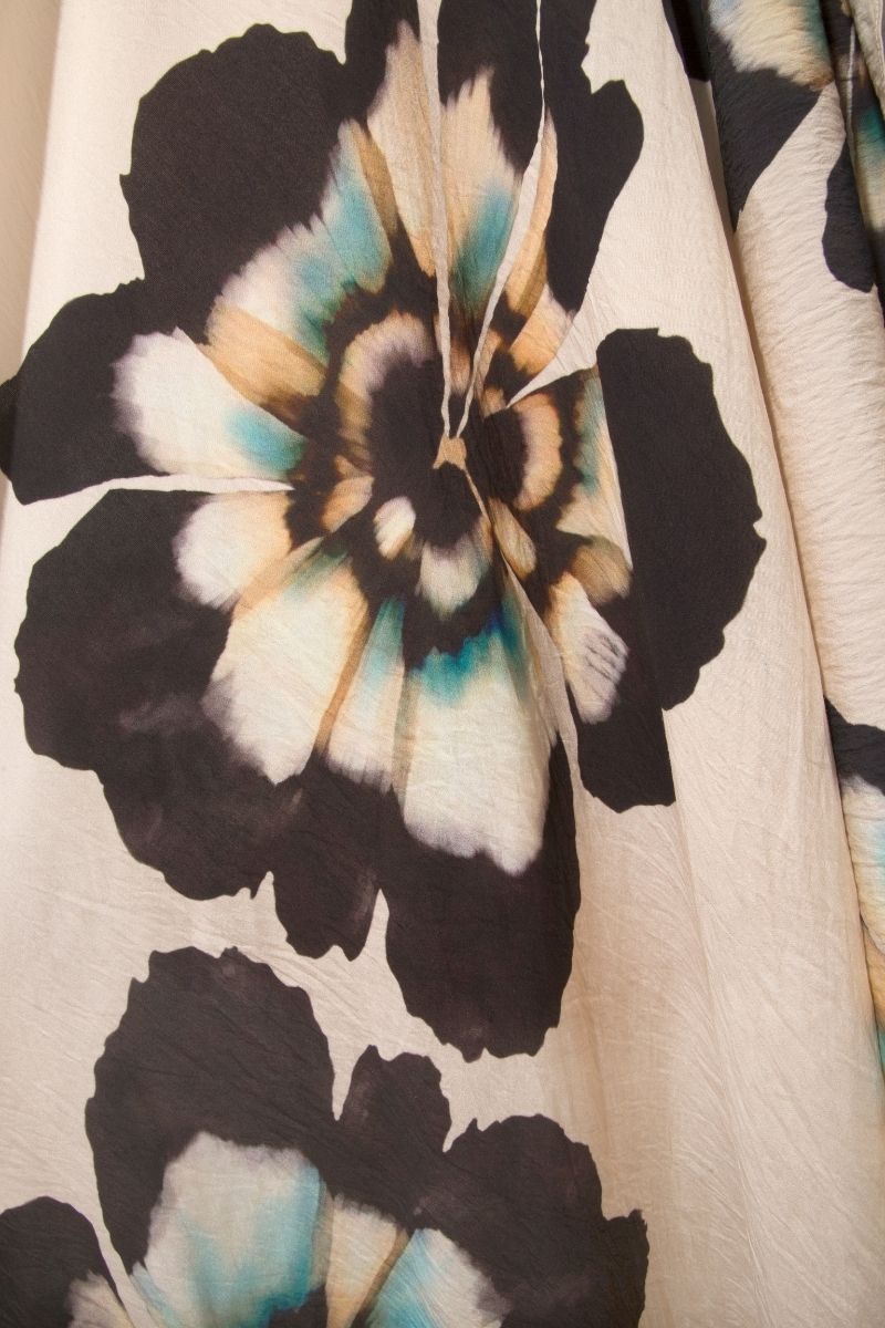 Sisters Lucy maxi dress in sandstone beige, flowing fabric, and elegant design, perfect for stylish summer wear.