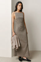 Lecia square-neck column maxi dress displayed on a hanger, showcasing its elegant design and flowing fabric.