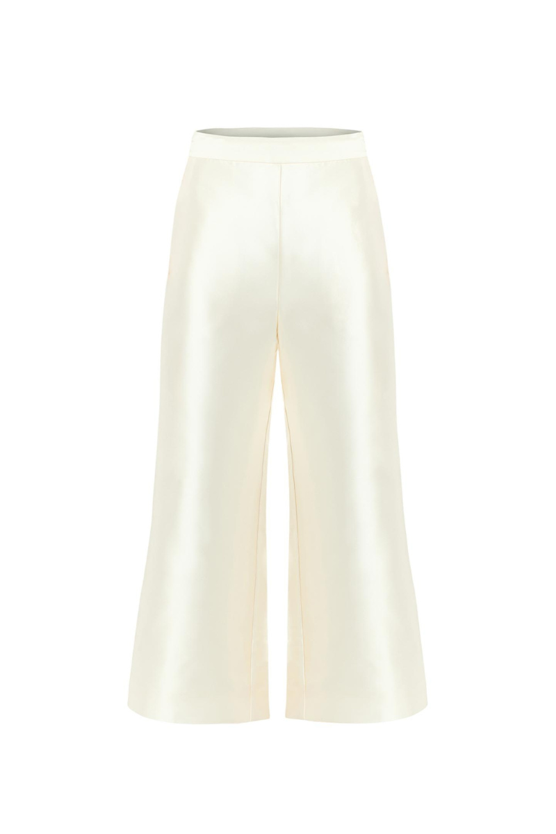 Mestiza New York Blake cropped pants in ivory, featuring a stylish slim fit and ankle-length design, shown on a model.