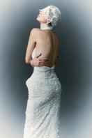 White Plan Atalia gown, elegant white evening dress with flowing fabric and classic design, perfect for formal occasions.