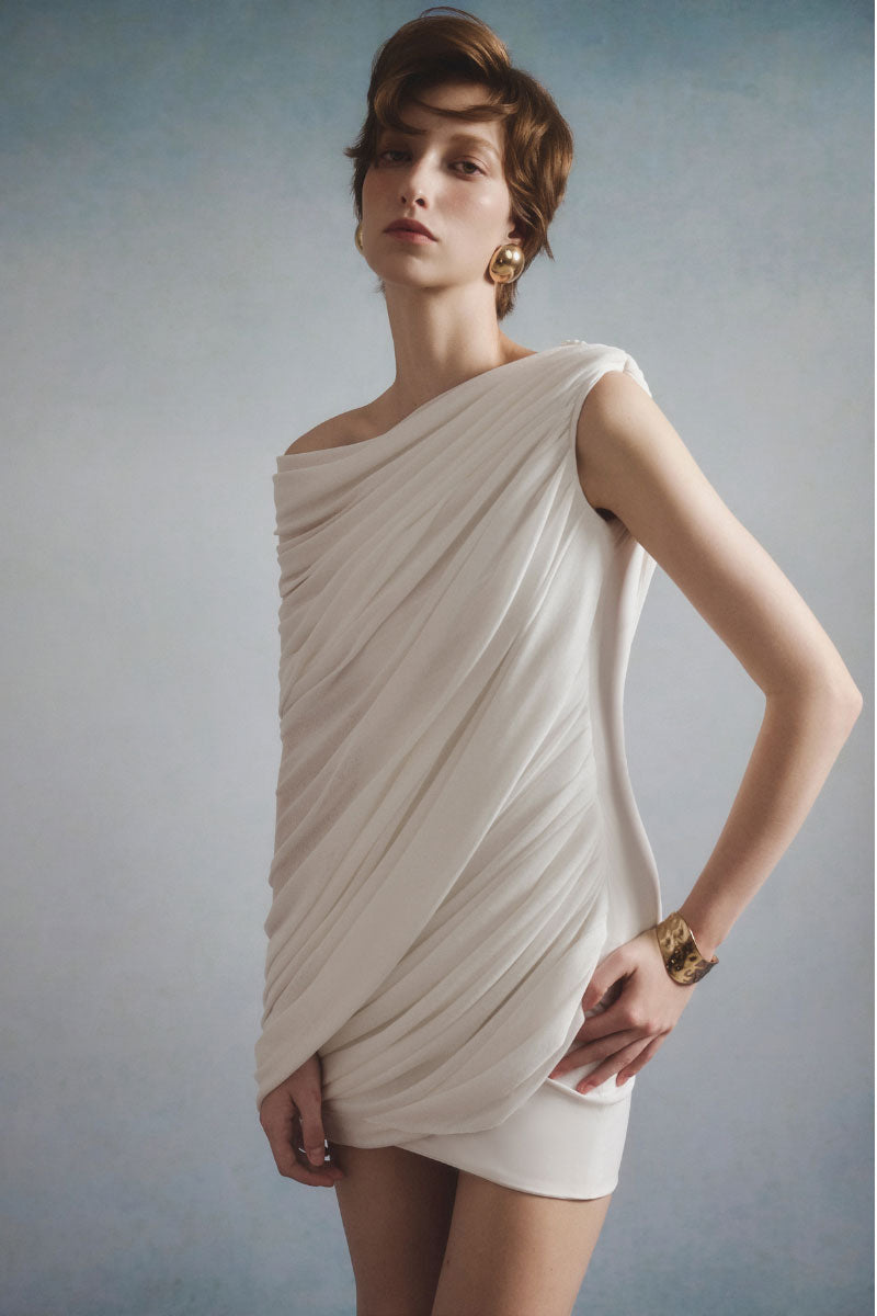 White Plan Lyra draped mini dress featuring a flowy silhouette and elegant detailing, perfect for stylish casual wear.