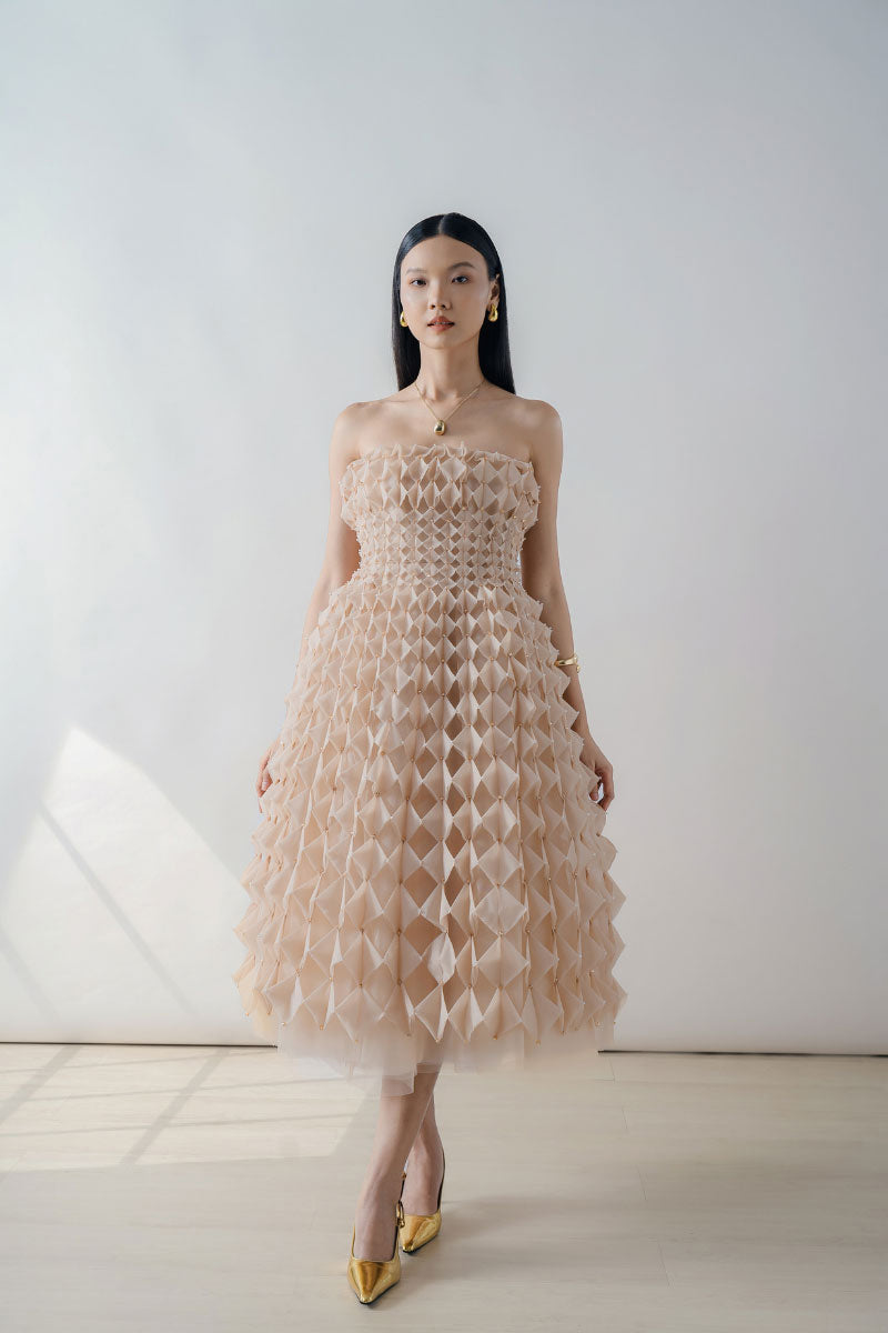 Nude Origami-Pleated Strapless Midi Dress by DOC BAN, showcasing its elegant pleated design and strapless style.