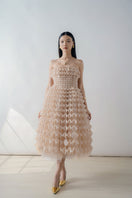 Nude origami-pleated strapless midi dress by DOC BAN, featuring a sleek, structured design and elegant midi length.