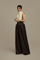 Black Aether trousers by POEM, stylish pants with a tailored fit, displayed on a neutral background.