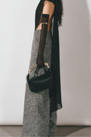 Gray tweed straight pants by Levia, featuring a tailored fit and classic design, shown on a model.