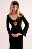 OvertheSea black insomnia midi dress displayed on a hanger with a sleek, elegant design and soft fabric.