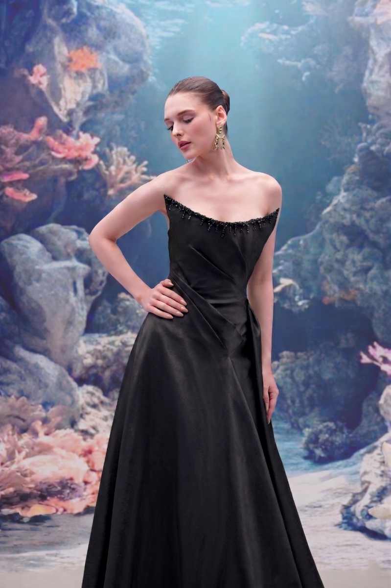 Black Thalassa Taffeta Dress by 21Six featuring elegant gown design with flowing fabric and sophisticated style.