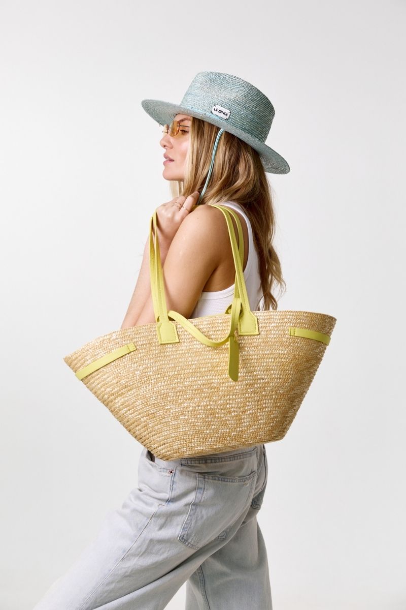Yellow summer shoulder bag by LE SH KA with a stylish design, featuring a spacious interior and adjustable strap.