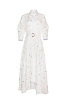 Estefania maxi dress featuring elegant ivory and gold camellia and lilies floral pattern, flowing shirt dress style.