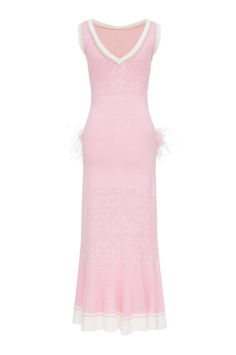 Andreeva peony knit midi dress displayed on a hanger, showcasing its soft fabric and stylish design.
