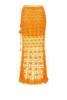 Orange handmade knit midi skirt with California poppy pattern from Andreeva, showcasing its textured fabric and flowing design.