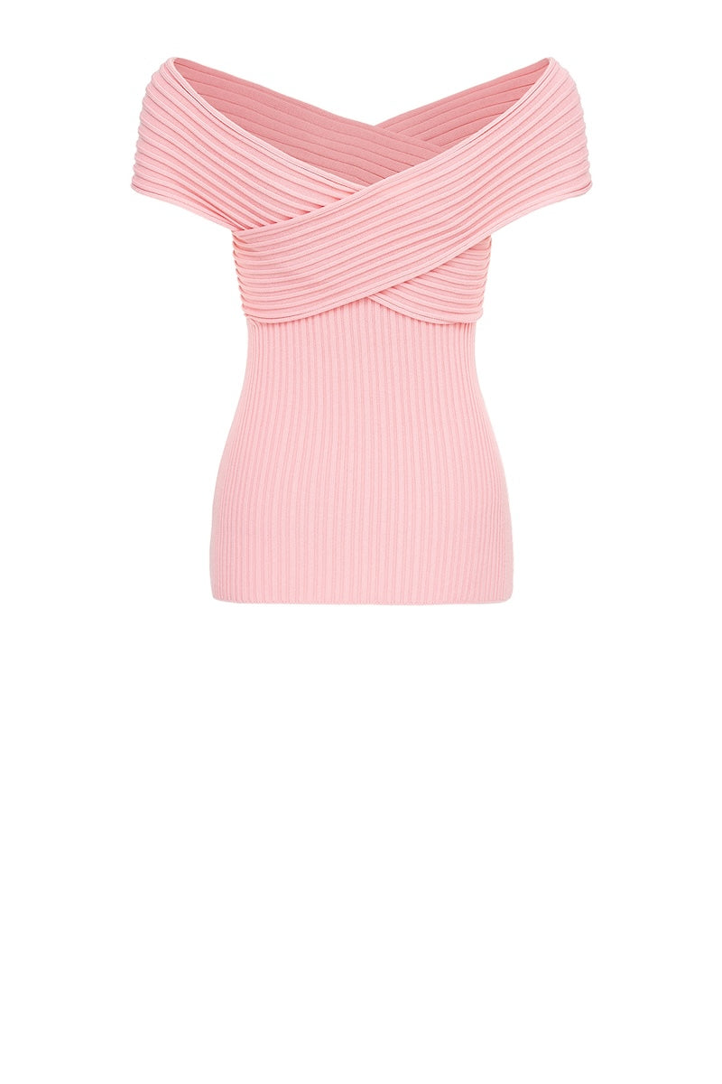 Andreeva Lily Light Pink Knit Top displayed on a hanger, showcasing its soft fabric and stylish fit.