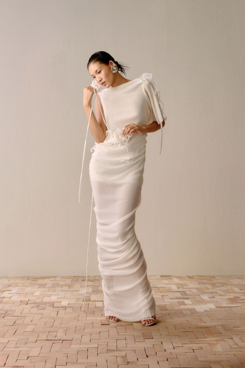 Lecia milky white draped backless sheer maxi dress with flowing fabric and elegant design, perfect for formal occasions.