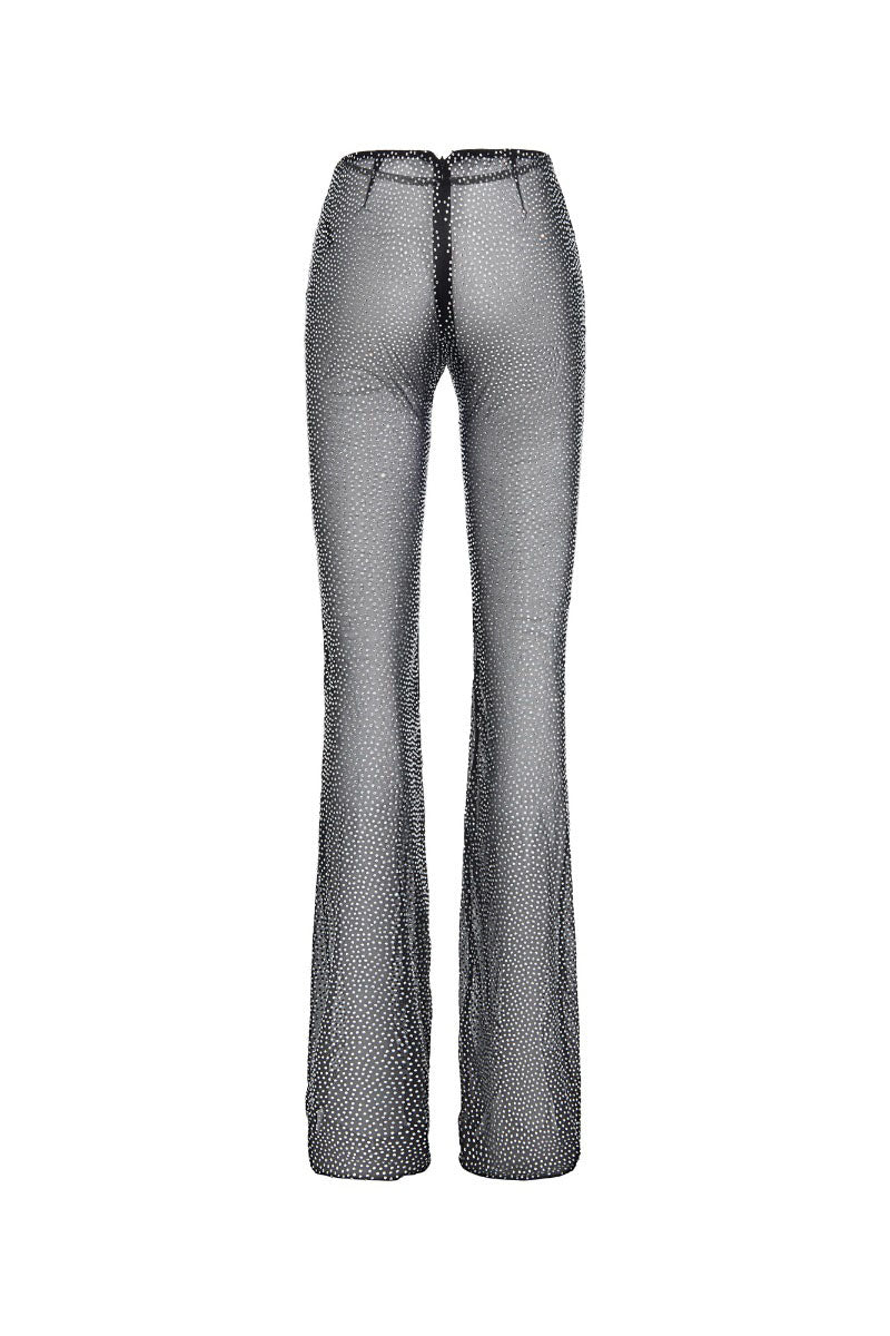 Black mesh pants from CEM featuring breathable mesh fabric and a relaxed fit, shown on a model.