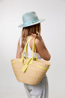 Yellow summer shoulder bag by LE SH KA with stylish design, featuring a spacious interior and adjustable strap.