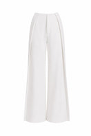 Folded Keira Tong layered pants in neutral fabric, showcasing the stylish design and texture of the pants.