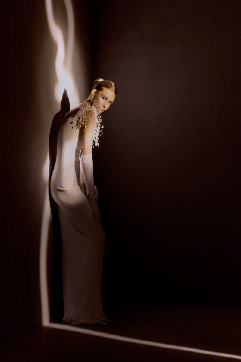 Elegant white gown from White Plan's Envious Dress collection, featuring flowing fabric and stylish design details.