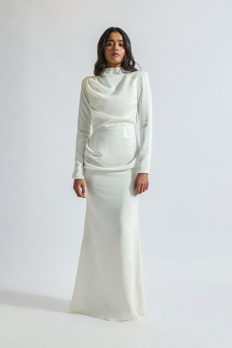 Deme By Gabriella CULT MIA X DEME maxi dress with flowing fabric and floral print, styled on a model for elegant summer wear.