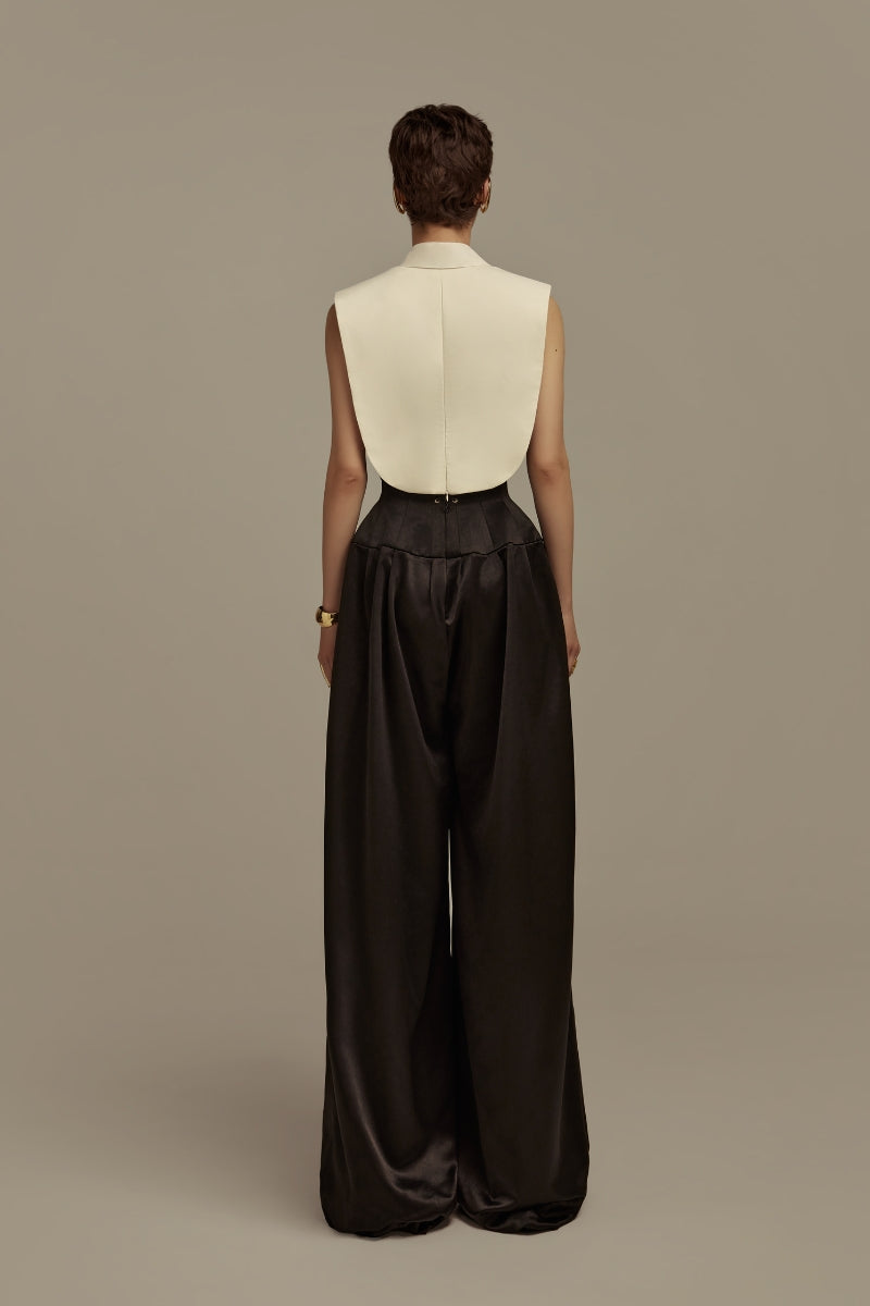 Black Poem Aether trousers with a sleek, tailored fit, featuring smooth fabric and stylish design details.