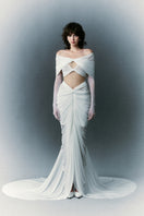 White Plan Palatine Dress gown with elegant fabric and detailed design, displayed on a hanger against a neutral background.