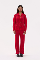 Red women's pants by La Granni, stylish and comfortable, shown on a model with a relaxed fit and modern design.