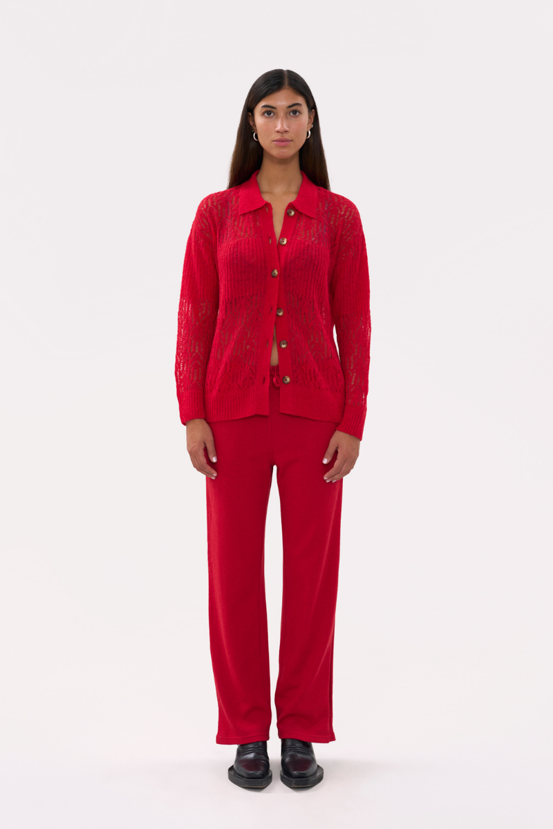Red women's pants by La Granni, stylish and comfortable, shown on a model with a relaxed fit and modern design.