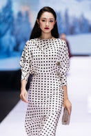Valenciani long sleeve ivory midi dress with a fitted waist and elegant design, perfect for sophisticated occasions.