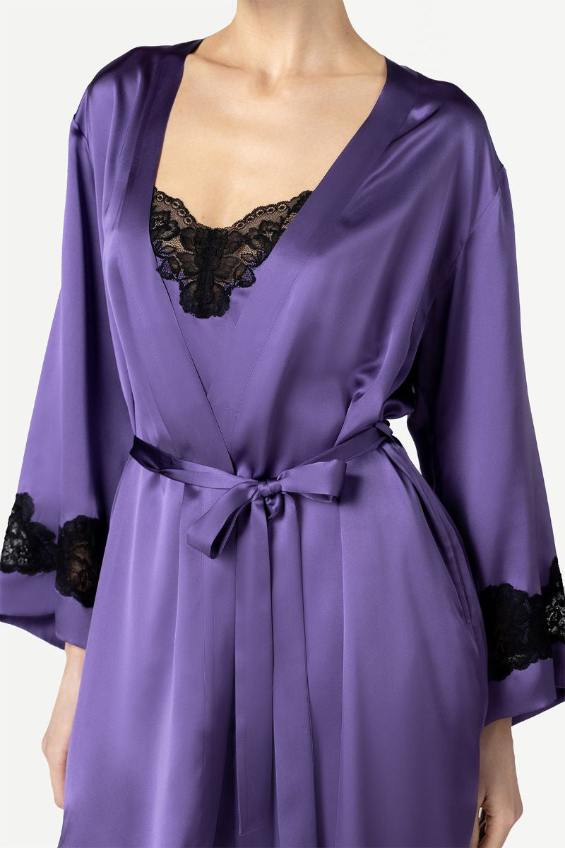 NK IMODE Morgan short robe in frosted violet, soft fabric with a relaxed fit, displayed hanging on a wooden hanger.