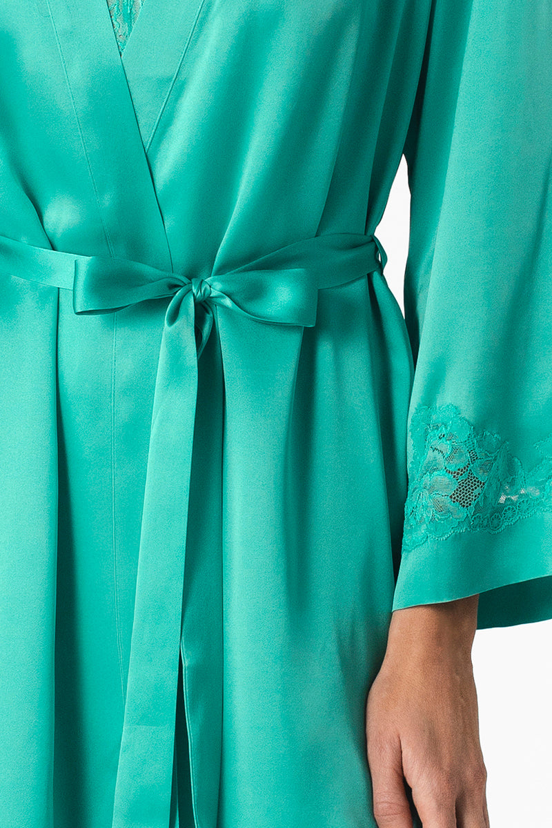 NK IMODE Morgan short silk robe in turquoise, lightweight and luxurious, with a relaxed fit and intricate silk fabric details.