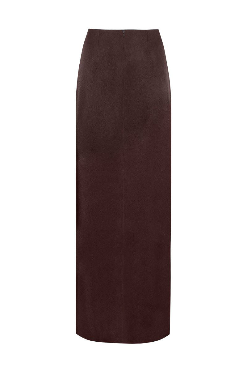 Brown SETA maxi skirt by LAURA ESCOBAR, flowing fabric with elegant drape, showcased on a model.